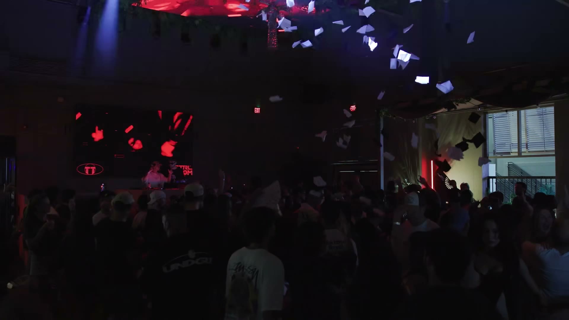 The CTRL ROOM dance floor beneath red and blue lights and falling confetti