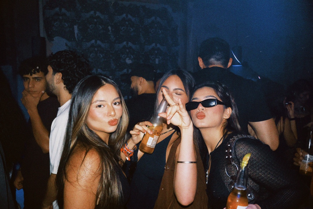 Friends posing together in the crowd